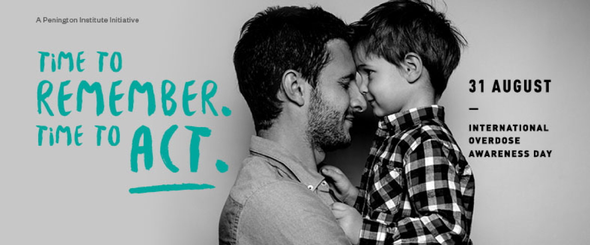 Image of man with child, noses touching, in black and white photograph. Text over image displaying "Time to Remember, Time to Act - August 31, International Overdose Awareness Day"